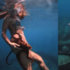 不速之客甩也甩不掉！美女在夏威夷潛水時，被章魚纏上腿